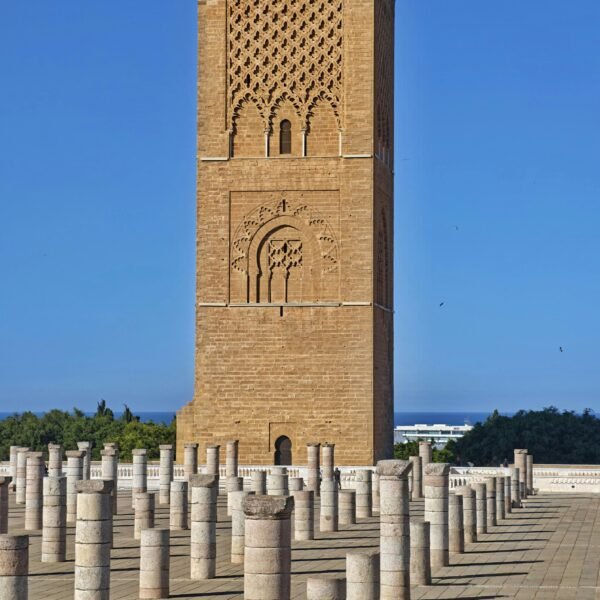 Explore the architectural beauty of Hassan Tower in Rabat, Morocco, on a sunny day.
