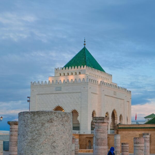 Historic Hassan Tower with Mausoleum in Rabat, Morocco at sunset, capturing Moroccan architecture.